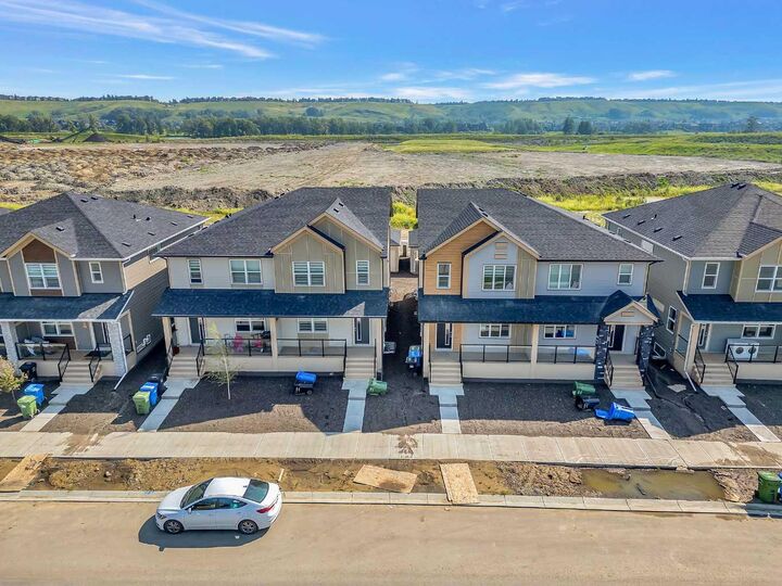 Property Photo:  822, 826, 830, 834 Wolf Willow Boulevard SE  AB T2X 5R5 