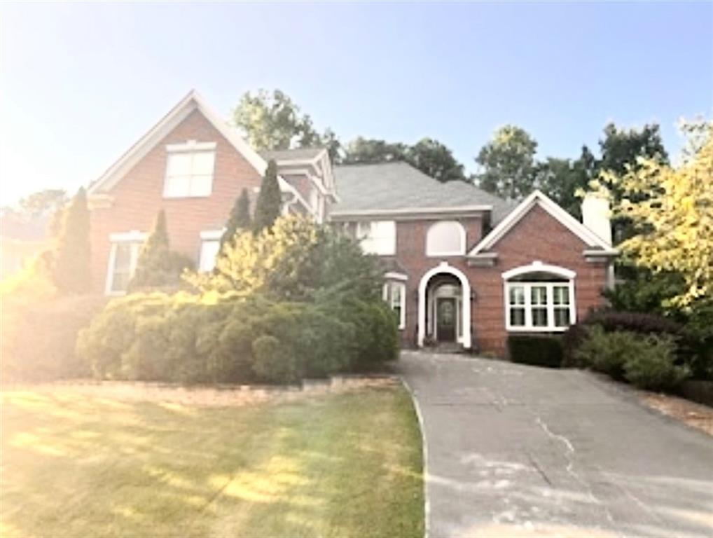 Property Photo:  545 Oak Bridge Trail  GA 30022 