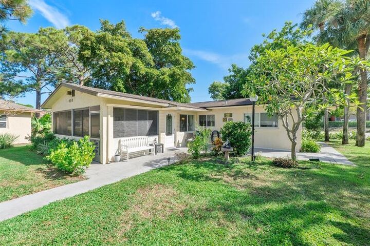 Property Photo:  410 SW Natura Ave  FL 33441 
