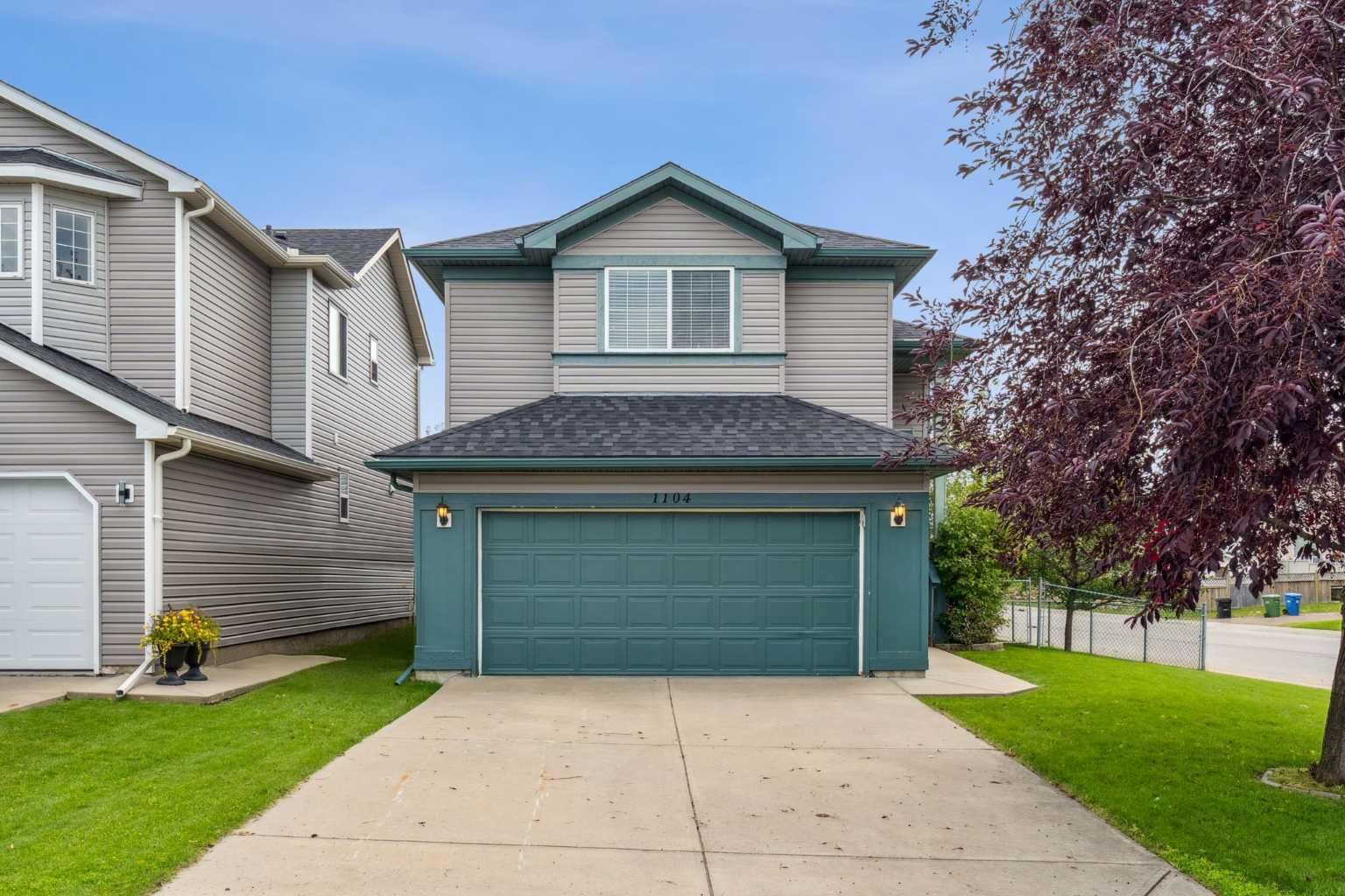Property Photo:  1104 Harvest Hills Drive NE  AB T3K 5C5 