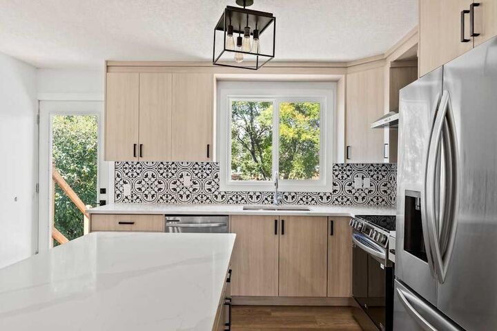 Property Photo:  856 Rundlecairn Way NE  AB T1Y 2R7 