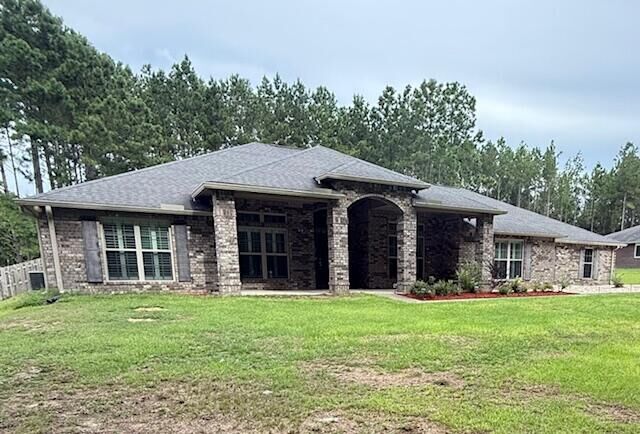 Property Photo:  6567 Welannee Boulevard  FL 32567 