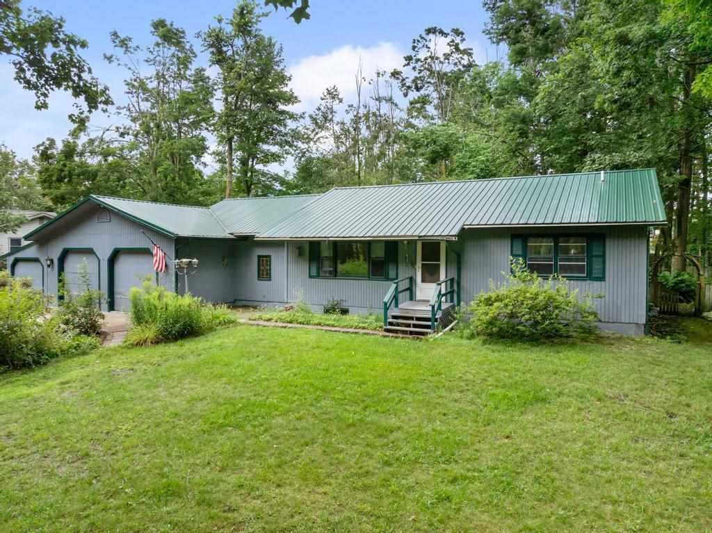 Property Photo: 1145 Woodland Dr MI 49770