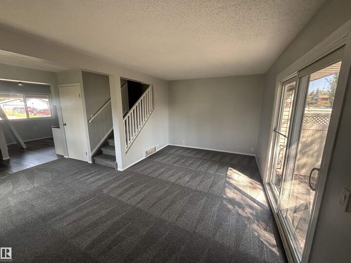 Property Photo: 13833 30 Street NW 1 AB T5Y 2B2