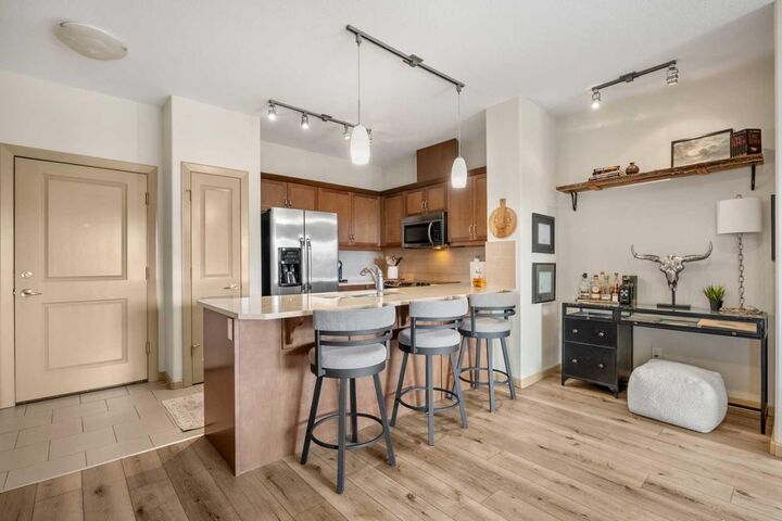 Property Photo:  310 McKenzie Towne Gate SE 1403  AB T2Z 1A6 