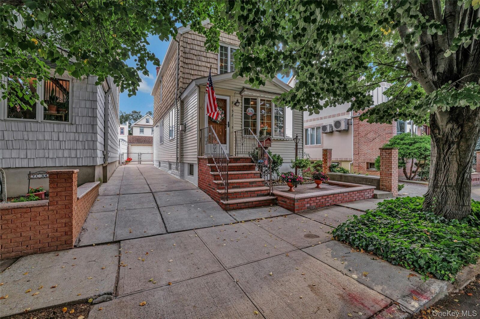 Property Photo:  71-52 58th Road  NY 11378 