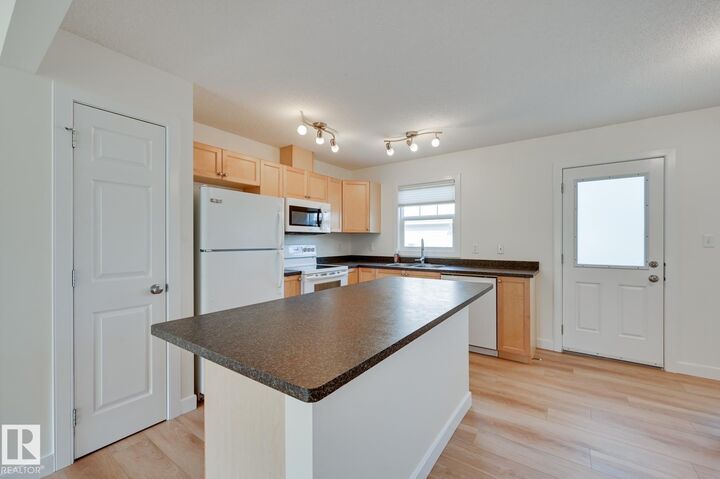 Property Photo:  6032 38 Avenue NW 38  AB T6L 0A4 