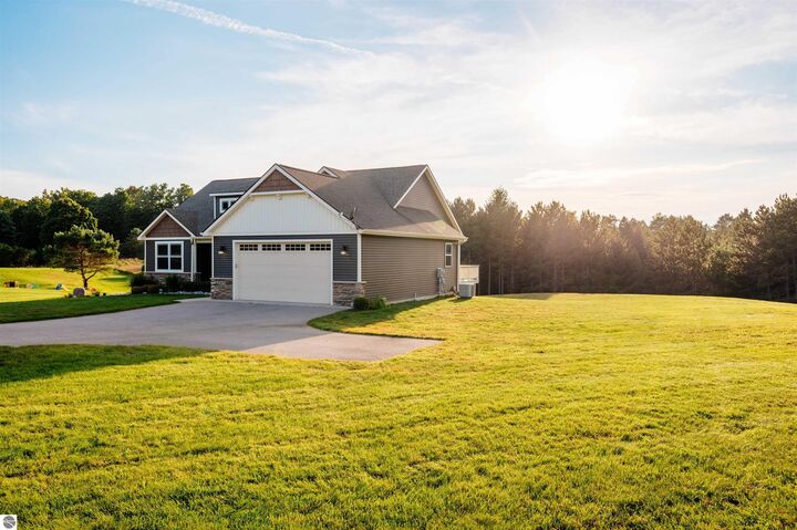 Property Photo:  3877 E Long Lake Road  MI 49685 