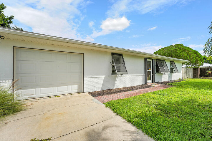 Property Photo: 401 SW Aster Road FL 34953
