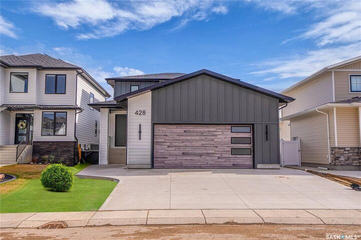 Property Photo:  428 Woolf Bend  SK S7W 1E5 