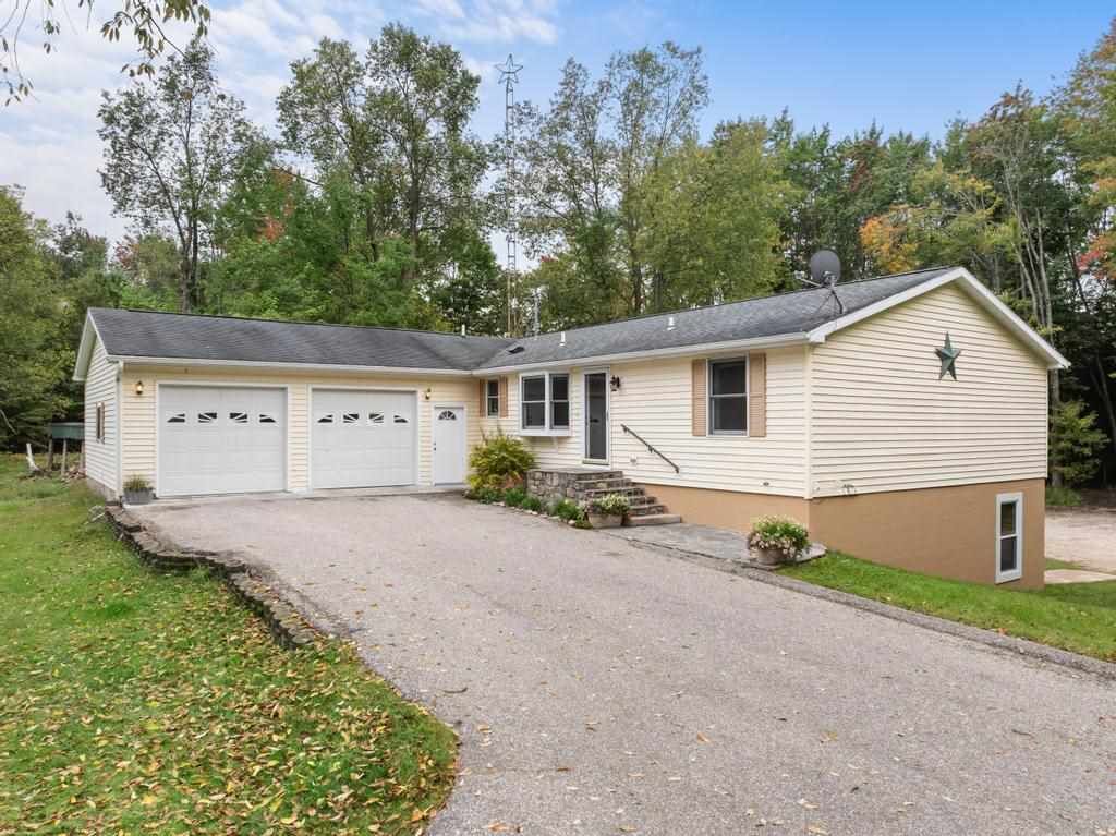 Property Photo:  1416 Maxwell  MI 49770 