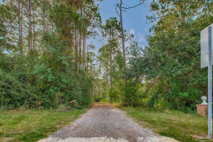 Property Photo:  5791 Whispering Woods Dr  FL 32571 