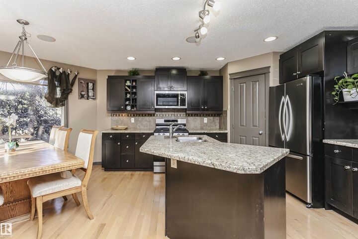 Property Photo:  1440 Potter Greens Drive NW  AB T5T 1J8 
