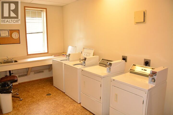 Property Photo:  10118 100 Avenue  AB T8S 1R3 