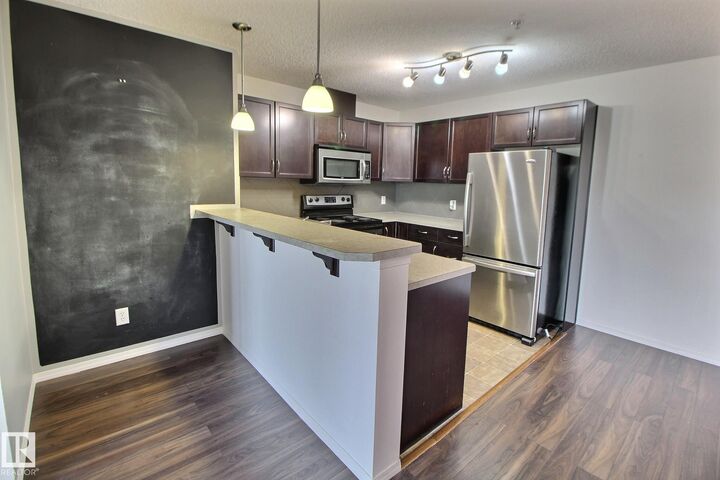 Property Photo: 5951 165 Avenue NW 205 AB T5Y 0J6