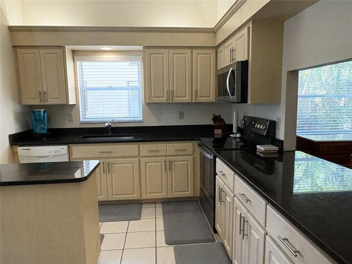 Property Photo: 4933 Village Gardens Drive 211 FL 34234