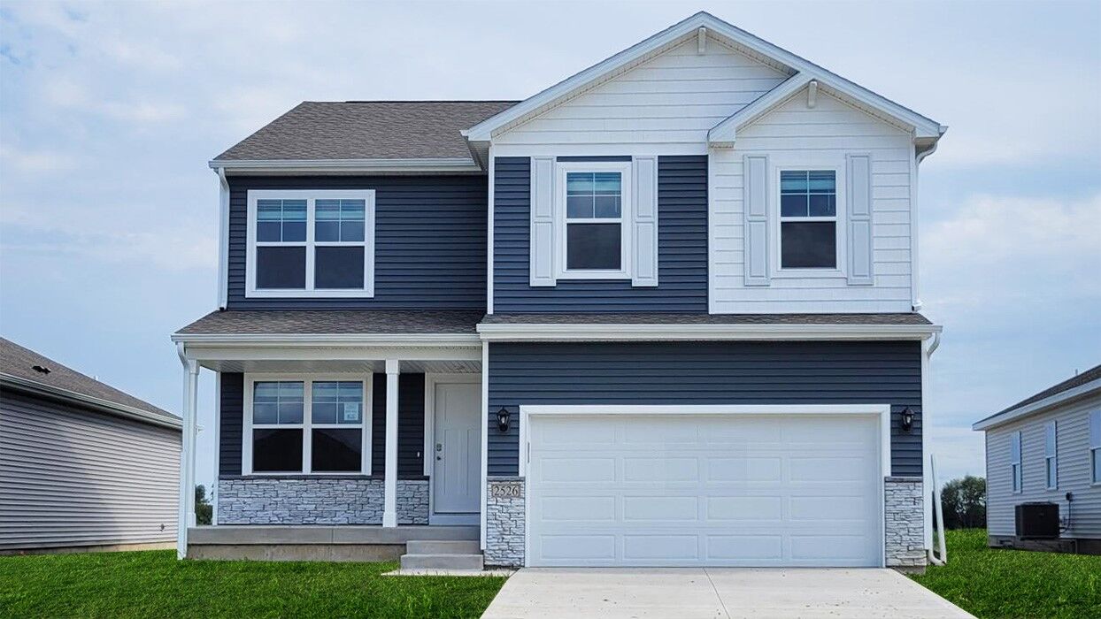 Property Photo: 728 Goldfinch Drive IA 52340