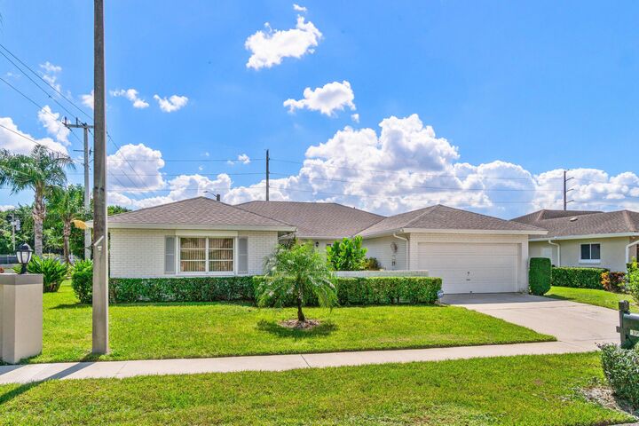 Property Photo:  10990 Greentrail Drive S  FL 33436