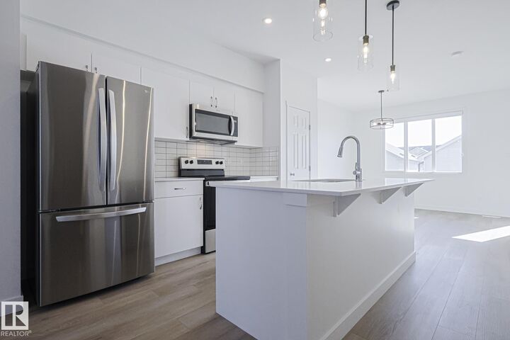 Property Photo:  6347 King Wynd SW  AB T6W 5P1