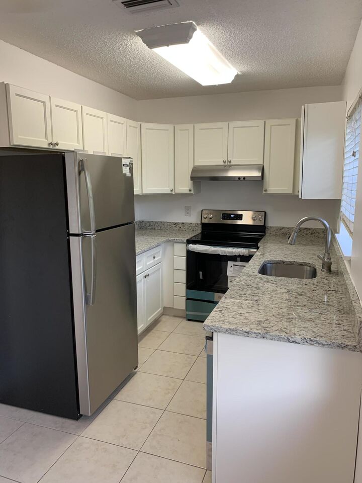 Property Photo:  6551 NE 7th Avenue B  FL 33487 