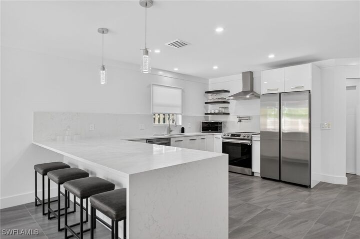 Property Photo: 565 110th Avenue N FL 34108