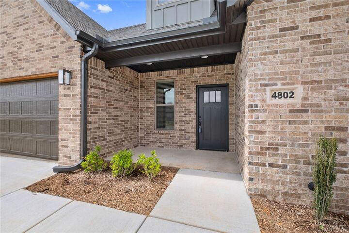 Property Photo:  4802 SW Scarlet Oak Street  AR 72713 