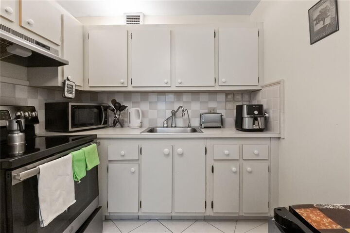 Property Photo:  1401 SW 135th Terrace 310H  FL 33027 