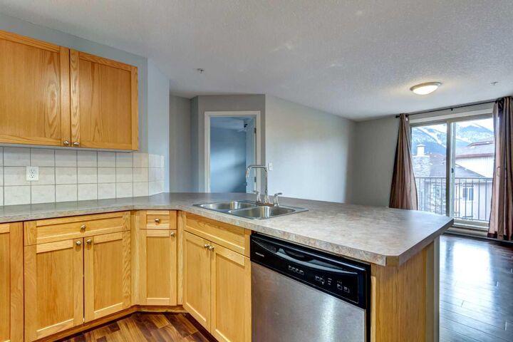 Property Photo:  186 Kananaskis Way 213  AB T1W 0A2 
