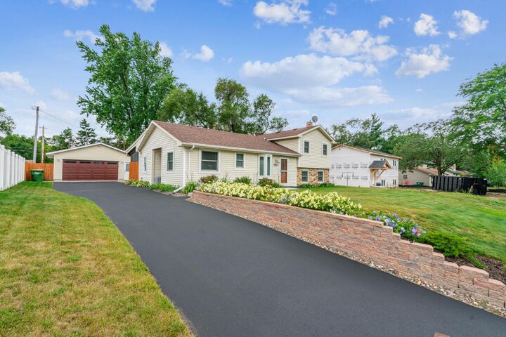 Property Photo:  208 106th Avenue NW  MN 55448 