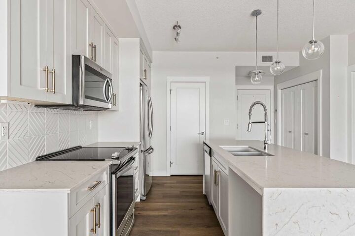 Property Photo:  300 Auburn Meadows Common SE 407  AB T3M 2Y3 