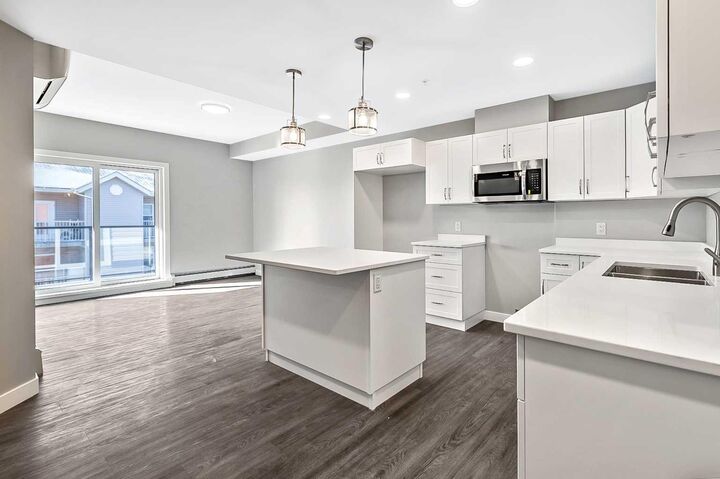 Property Photo: 97 Station Drive 302 AB T4S 0S6