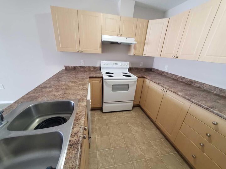 Property Photo:  1615 41 Street 411  AB T7E 0A7 