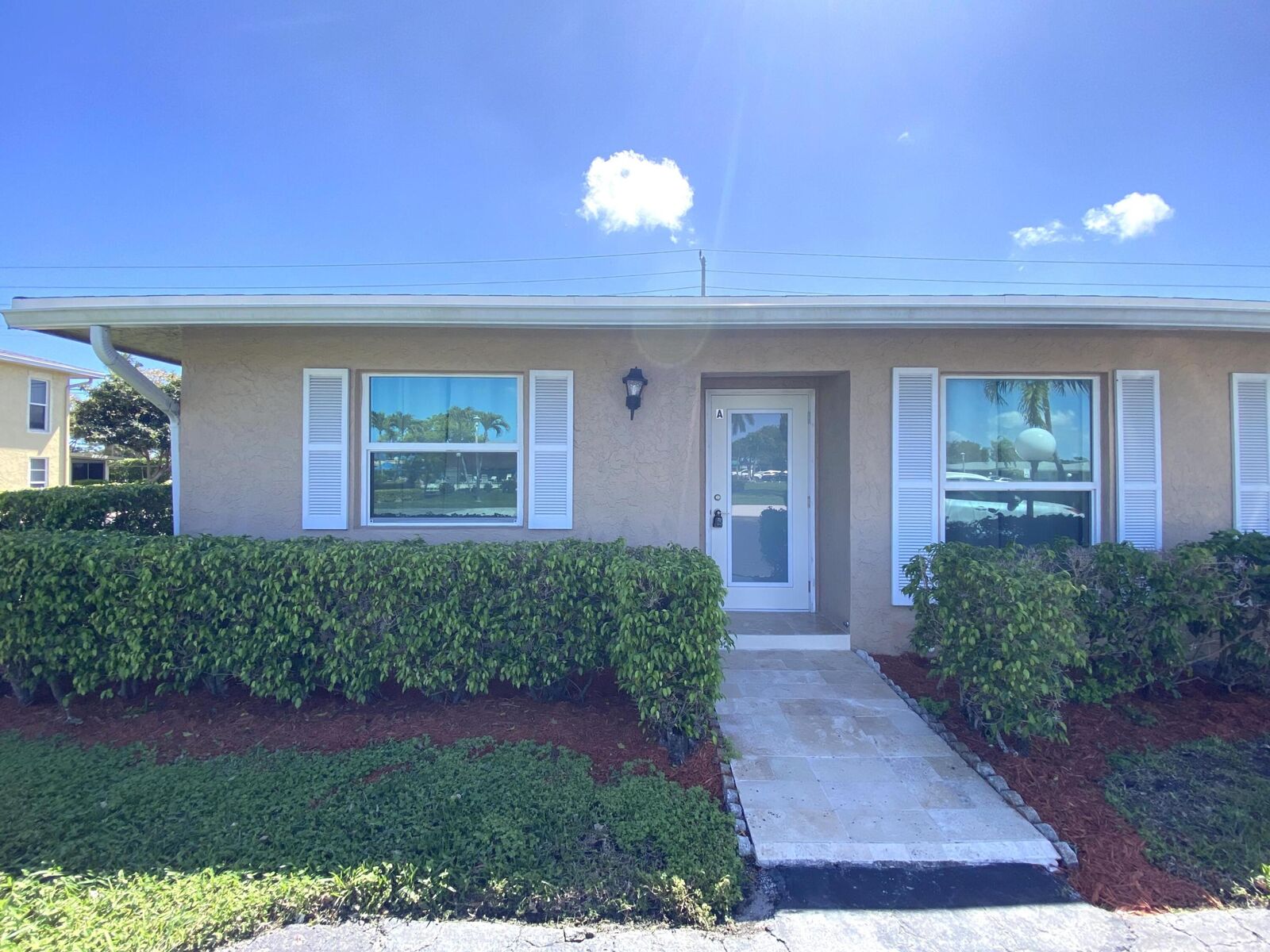 Property Photo:  2450 Black Olive A  FL 33445 