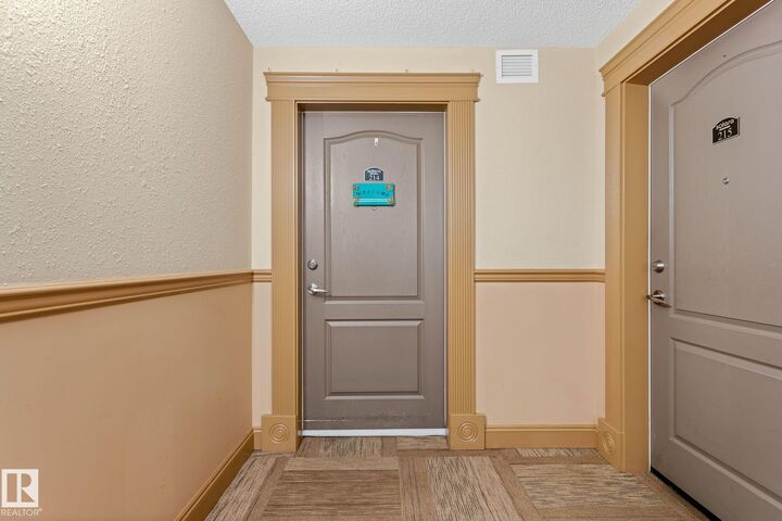 Property Photo: 12650 142 Avenue NW 214 AB T5X 0J4