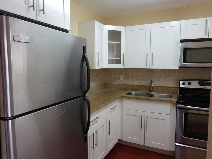 Property Photo:  6050 NW 64th Avenue 307  FL 33319 
