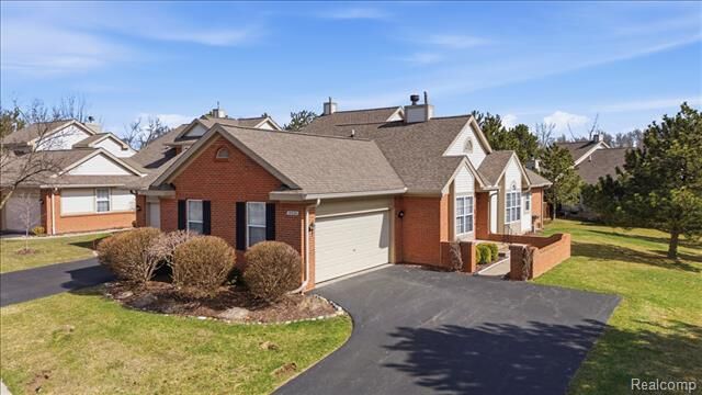 Property Photo:  10324 Champions Circle 44  MI 48439 