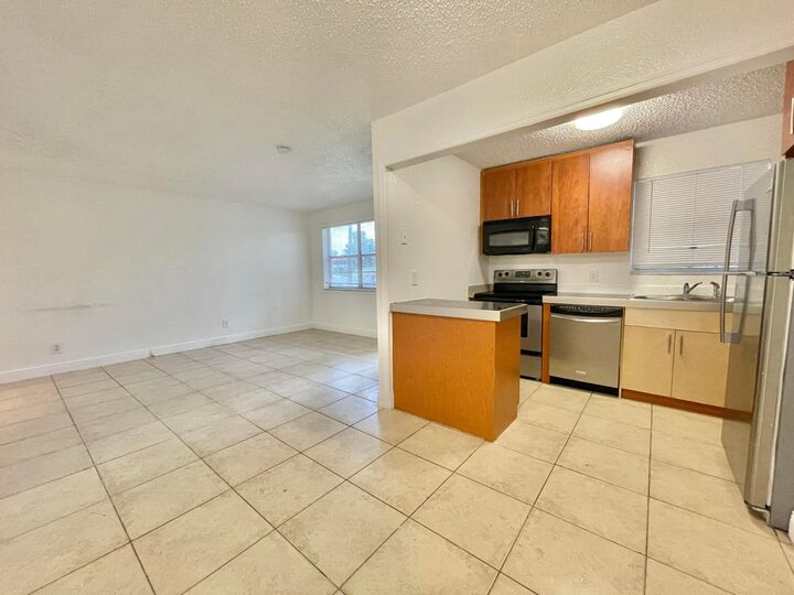 Property Photo:  400 NW 65th Avenue 114  FL 33063 
