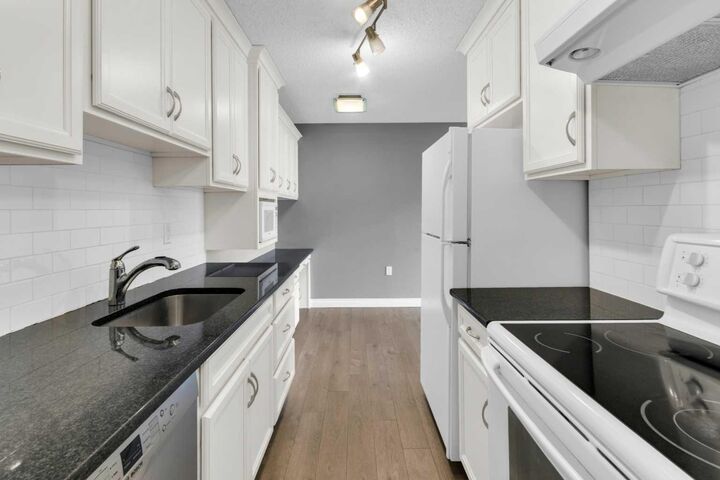 Property Photo:  1602 11 Avenue SW 210  AB T3C 0N2 