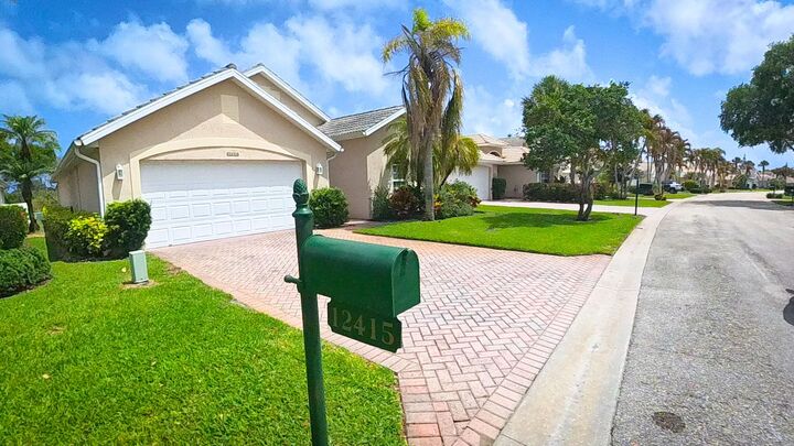 Property Photo: 12415 SE Plandome Drive FL 33455