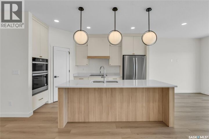 Property Photo:  4 720 Brighton Boulevard  SK S7V 1X1 