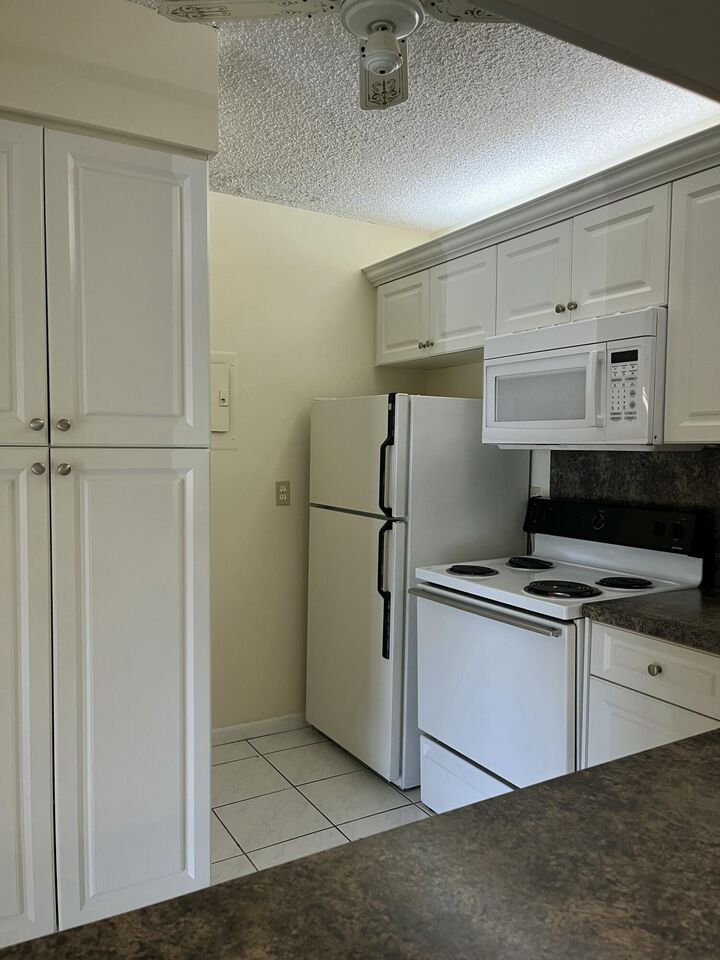 Property Photo:  708 Sunny Pine Way A1  FL 33415 