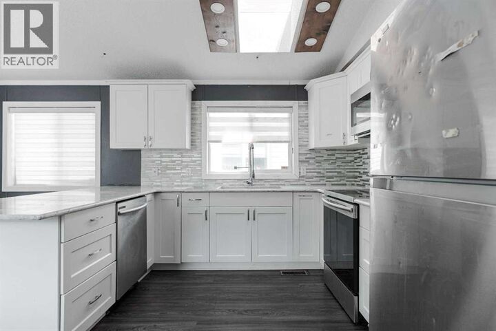 Property Photo: 216 Harpe Way AB T9K 2K8