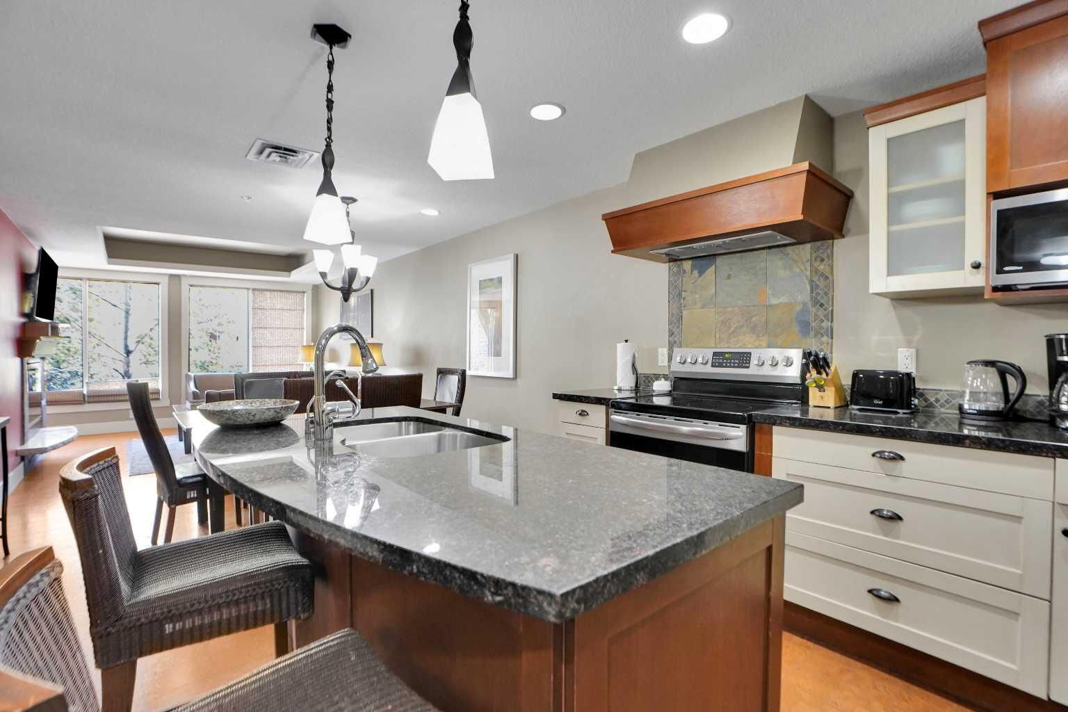 Property Photo:  187 Kananaskis Way 210  AB T1W 0A3 