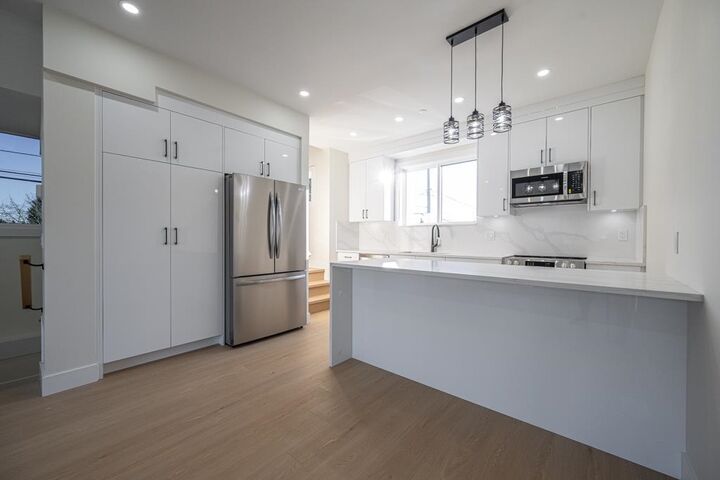 Property Photo:  7533 Wren Street B  BC V2V 3C1 