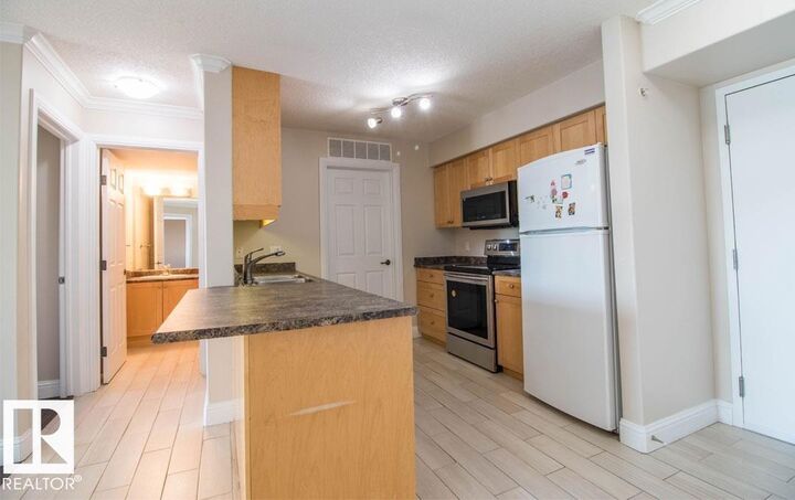 Property Photo:  13111 140 Avenue NW 418  AB T6V 0B1 