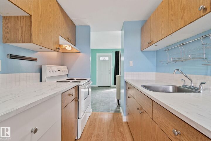 Property Photo:  857 Abbottsfield Road NW  AB T5W 4R4 