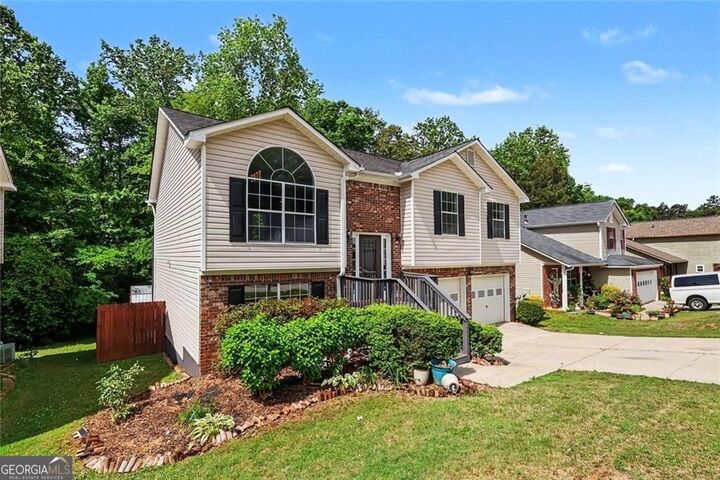 Property Photo:  5687 Wellborn Oaks Court  GA 30058 