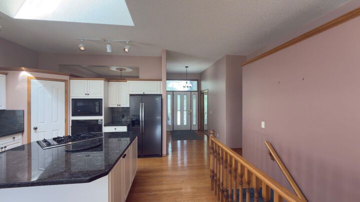 Property Photo:  117 Woodpark Close SW  AB T2W 6H1 