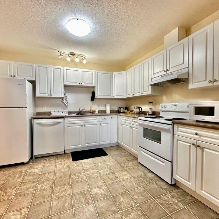Property Photo:  9508 99 Street 101  AB T0A 2C0 