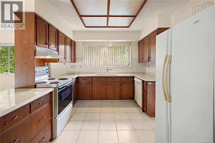 Property Photo:  3976 Tudor Avenue  BC V8N 4L6 